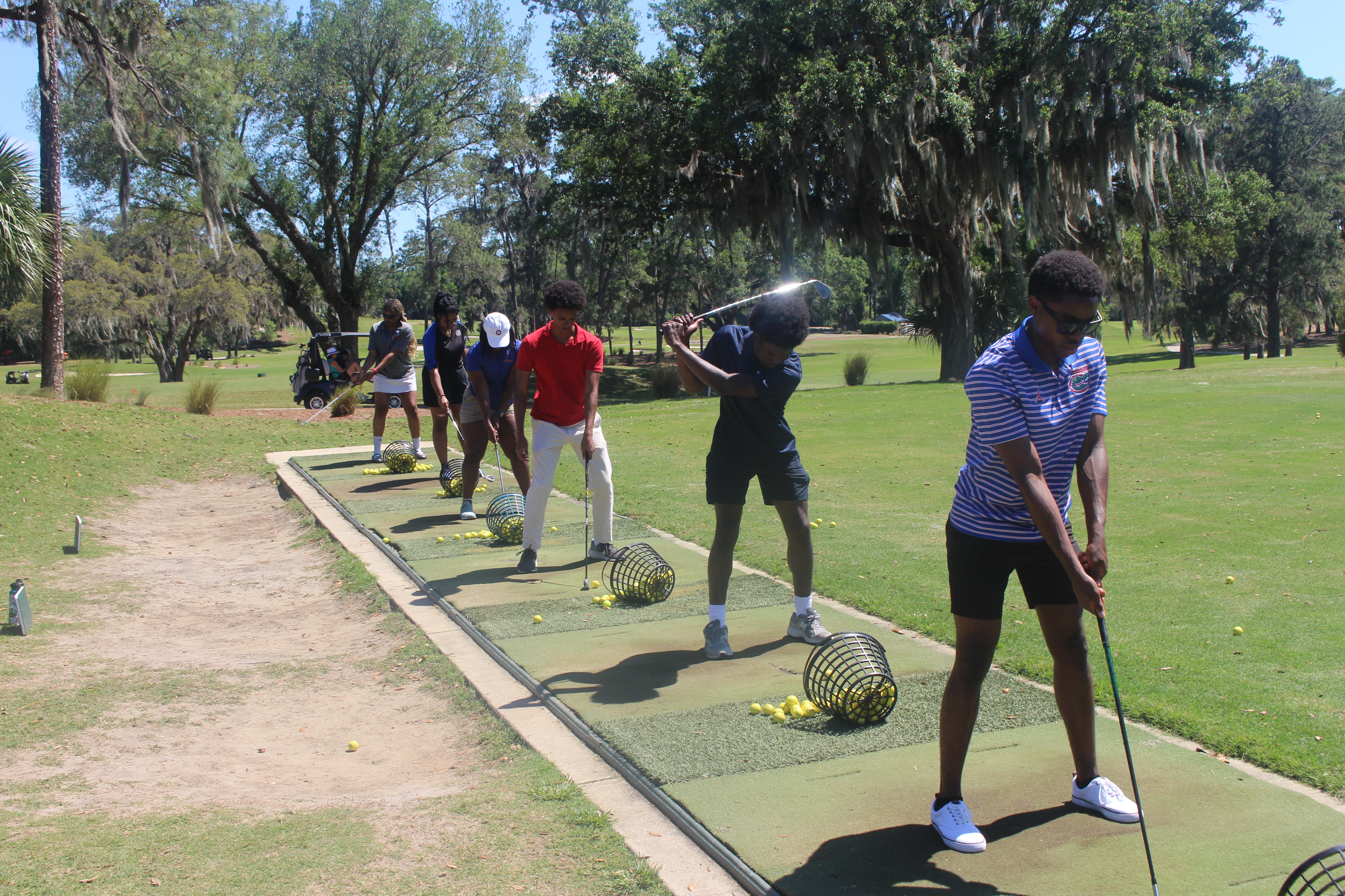UF NSBE members participating in a golf clinic